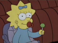 Maggie with a lollipop