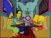 The Simpsons dine with John at Sha-Boom Ka-Boom! in Homer's Phobia