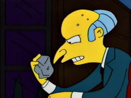 Burns holding a rock thrown through his window by Bart Simpson
