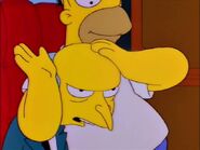 Homer beating Burns' head like a bongo drum