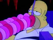 Homer filling up with Donuts.