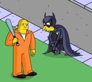 Fruit-Bat-Man battling a felon.