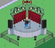 Krusty doing standup at the Open Air Stage.