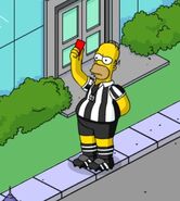 Referee Homer refereeing Tap Ball.
