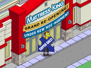 Marv Aggressively Advertising in front of the Mattress King.