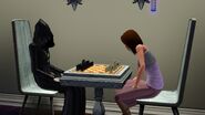 A Sim playing chess with the Grim Reaper.