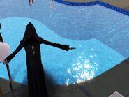 The grim reaper taking the soul of someone who drowned, note the pool