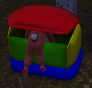 A toddler in a toybox.