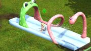 A toddler on a water slide