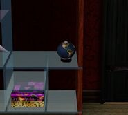 Globo terráqueo en Los Sims 3 sobre una estantería