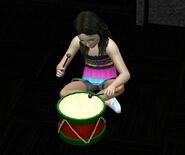 A child playing with Bang It Kids Drum.