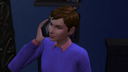 A Sim using her mobile phone in The Sims 4