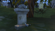 Mysterious grave with two dolls near the path leading to the Straud Mansion