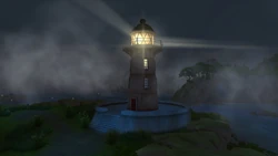 The lighthouse seen at night with light on.