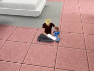 A toddler being read to by his teen brother.
