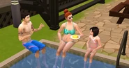 Three Sims sitting on the pool deck in The Sims 4.