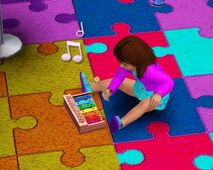 A toddler playing with her xylophone