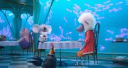 Buster discussing with Eddie his idea for a singing competition.