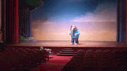 Meena trying to audition on stage.