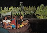 An Indian chief's skeleton paddles a skeleton canoe