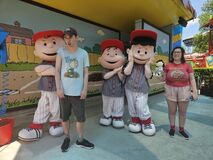 Charlie Brown, Linus, and Lucy in baseball outfits at Dorney Park.