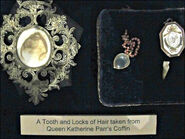 A tooth and locks of hair taken from Catherine Parr's coffin.