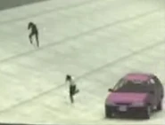 05-HumansAndCarFleeing.jpg (10 KB) A car seen driving away from the Flying Giant Skibidi Toilet in Episode 5.