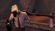 The axe stuck in Floral Tied Medic Cameraman's shoulder.