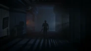 Dave walking towards the end of the hallway.
