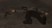 An AK-47 lying next to a dead Human.