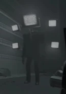 40- LargeTvManLookingAtPOv.jpg (130 KB) Large TV Man looking at the POV-Cameraman waiting for him to put on his lens.