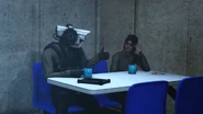 The girl smiling at the Guard Cameraman as he gives a thumbs up.