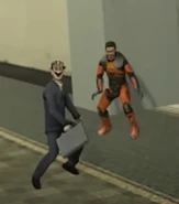 02-SmallHumanoidGManAndGordonFreemanAppearing.jpg (73 KB) Humanoid G-Man and Gordon Freeman dancing in front of the elevator at the start of the episode.