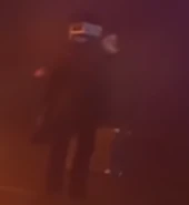The Detective on a crate in the Void with Large TV Man 2.0 in Part 3.