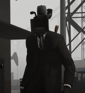 A Large Cameraman with a Stun Baton on his back.