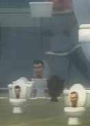 A Black Skibidi Toilet alongside the Hanging Water Tank Skibidi Toilet in Episode 25.