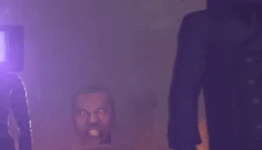 The Bladewielder Strider Skibidi Toilet, barely visible through the fog, approaches the group of  and . His steps cause the screen to shake.