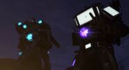 Titan Cameraman 2.0 and Titan TV Man 2.0 giving a waving finger to Titan Speakerman 2.0.