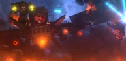 The other Obliterator getting acid all over his face and falls to the ground.
