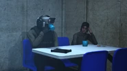 The Guard Cameraman attempting to drink coffee but it spills.