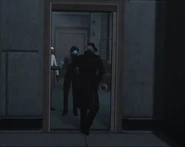 Detective Cameraman leaves the room.