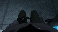 Camerawoman looking down at her legs in depression.