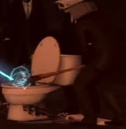 The Baseball Bat Speakerman hitting a Hexa-Claw Skibidi Toilet with the Baseball Bat.
