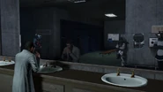The POV-Cameraman observing the human scientist, who's washing his face.