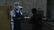 The Chef Cameraman offering food to a national guard soldier.