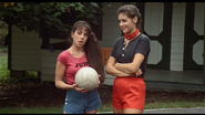 Meg and Judy watching Angela and Paul talking to each other while volleyball.