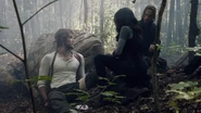Nick's wounds are attended to after he's found injured in the woods.