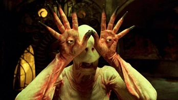 The Pale Man attaching his eyes to his hands