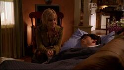 Chloe reads Clark a letter.