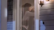 Clark using the in-colour version to peer through Lana’s front door.